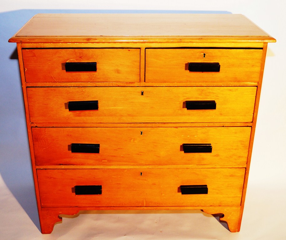 A pine chest of drawers