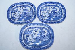 Three blue and white platters