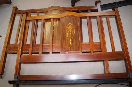 An Edwardian mahogany bed