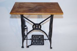 A cast iron sewing machine table