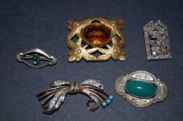 Four antique brooches and one lapel clip