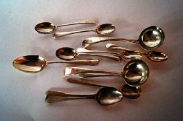 A collection of silver spoons etc.