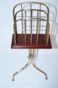 A mahogany and brass music stand