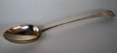 A large silver basting spoon