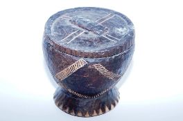 A wooden tribal bowl, possibly a blood letting bowl