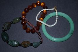 Jade bracelet and three others