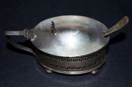 A silver mustard pot, with silver and spoon and blue liner