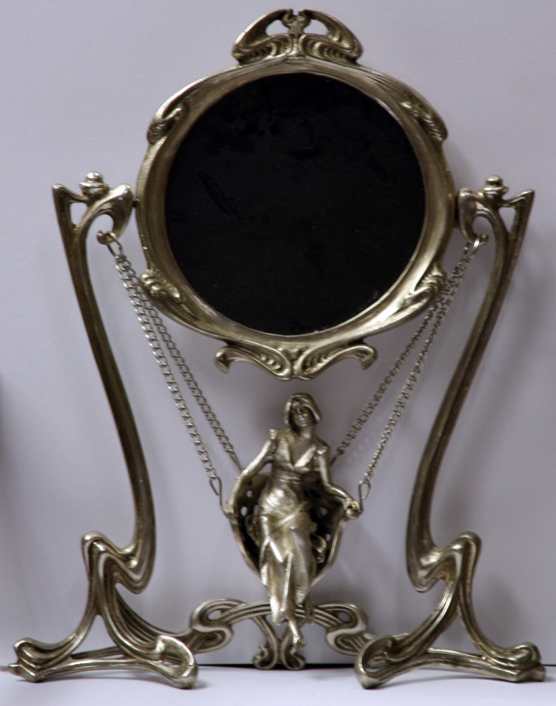 Silver plated mirror with figure