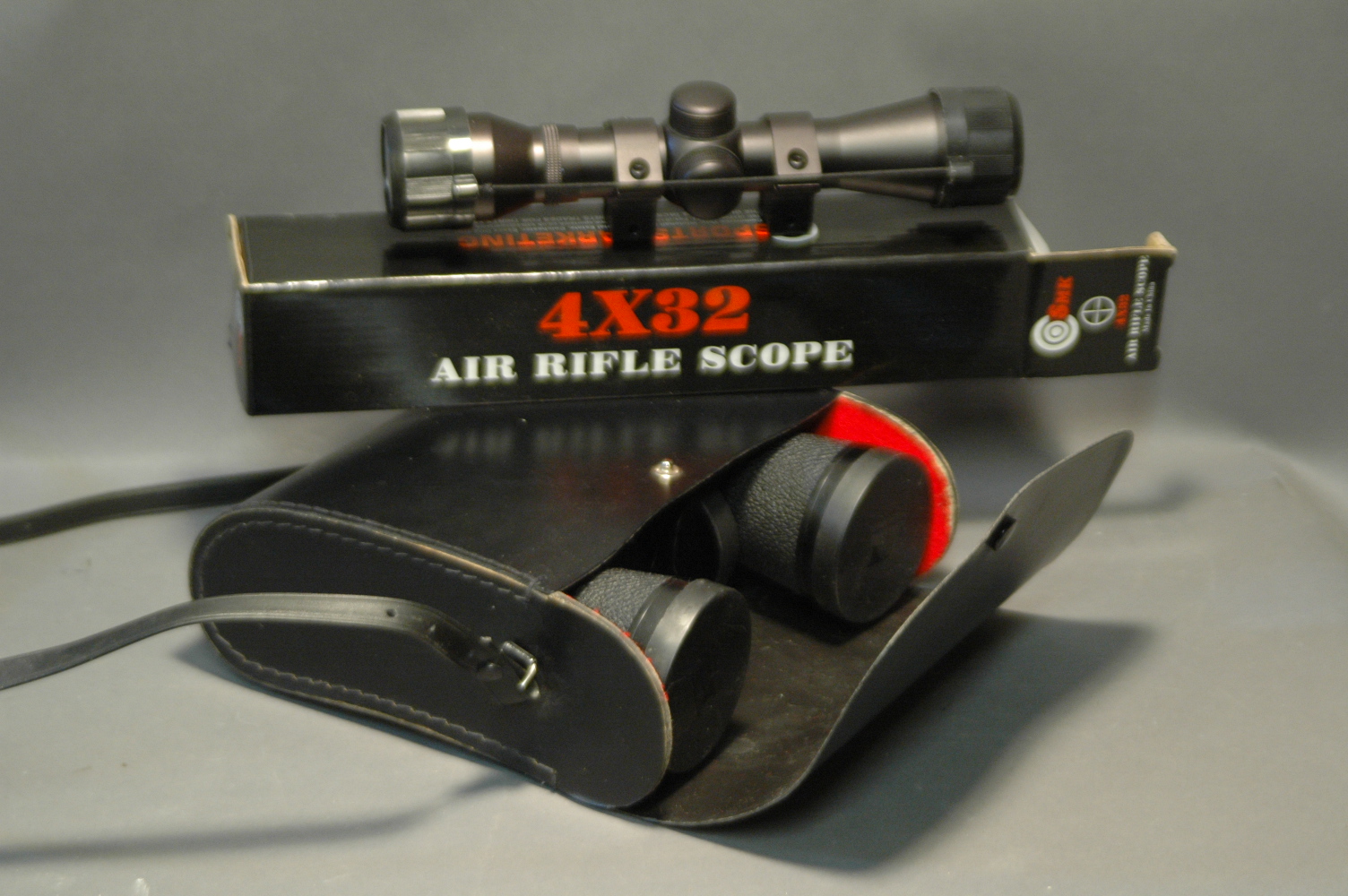 SMK 4 x 32 air rifle scope, brand new, and pair of Hanimex 7 x 50 binoculars.