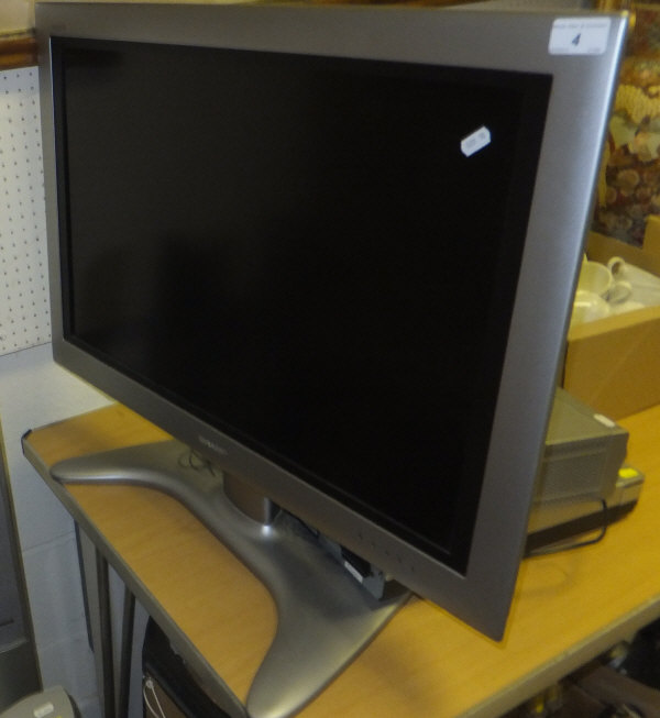 A Sharpe's LCD colour television model LC-305V4E, together with a Panasonic surround sound system,