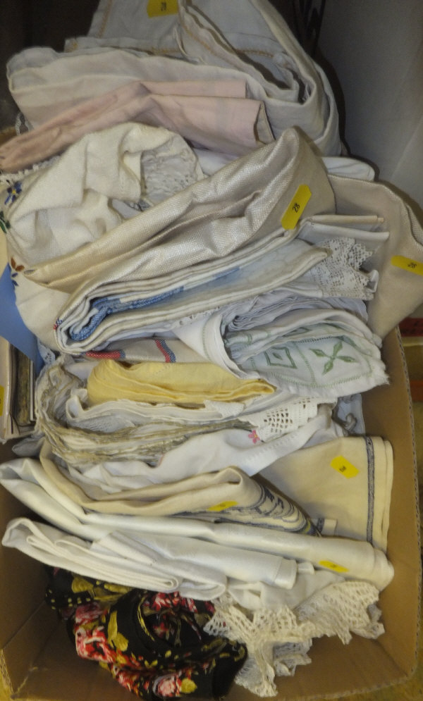 A box of assorted linen to include tablecloths, napkins, etc.