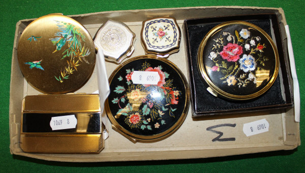 A box containing assorted Stratton compacts, to include an Art Deco style gold coloured and black