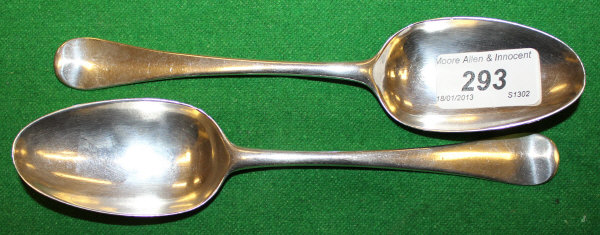 A pair of George II silver Old English pattern dessert spoons (by Ebenezer Coker, London 1755)