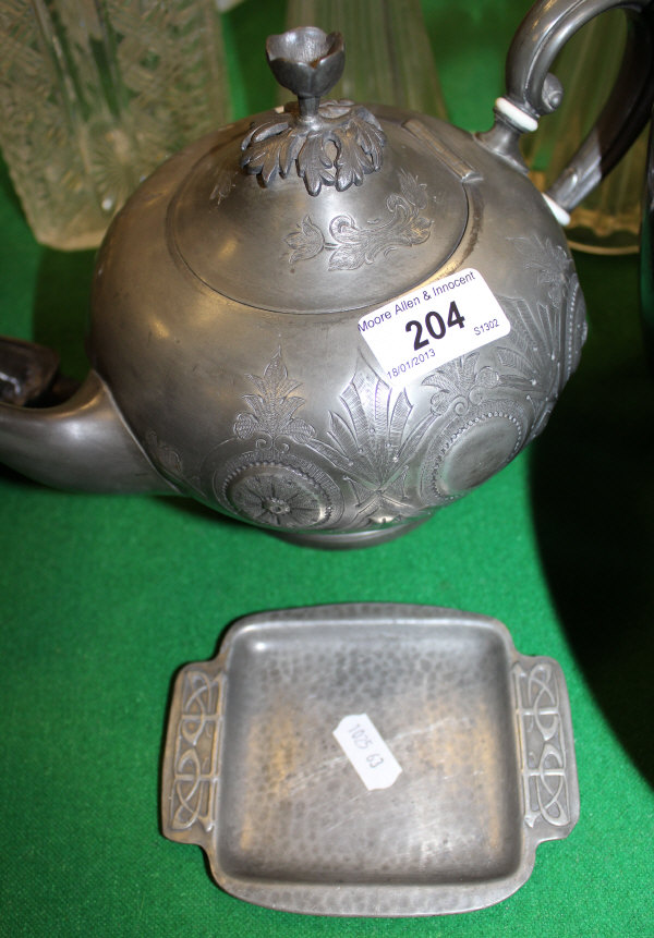 A Liberty & Co. Tudric pewter dish with Art Nouveau style lug handles, designed by Archibald Knox,