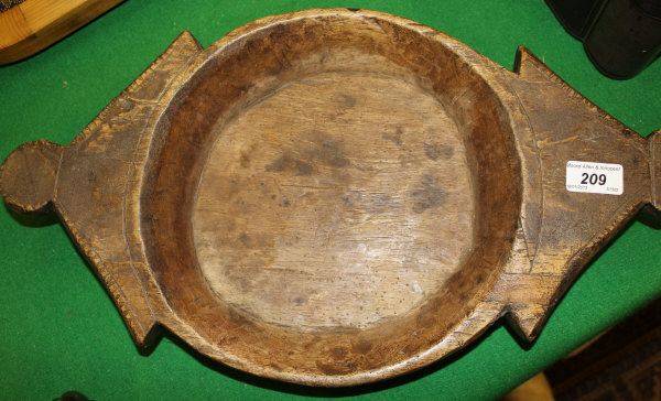 A twin-handled tribal feeding bowl with angular lug handles CONDITION REPORTS 51 cm wide
