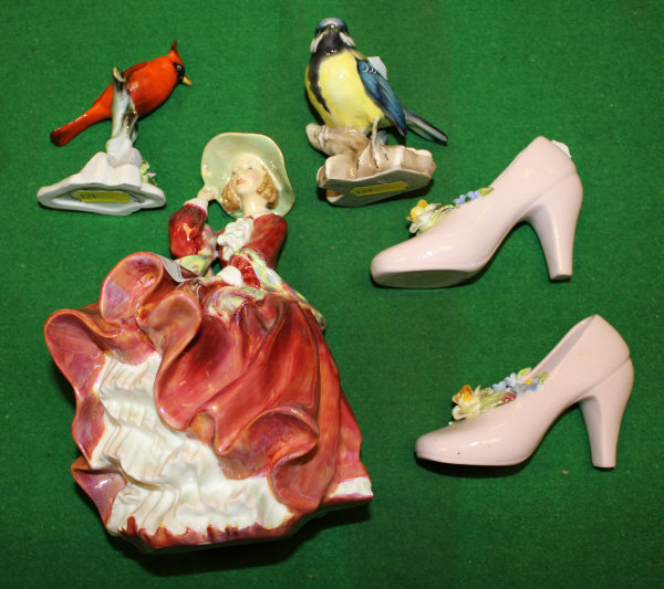 A Royal Doulton figurine "Top o' the hill", No'd. HN1834, two bird ornaments and a pair of