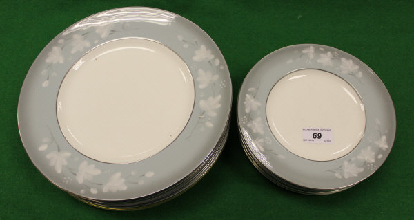 A collection of Royal Worcester "Moonflower" pattern plates comprising eight dinner plates and eight