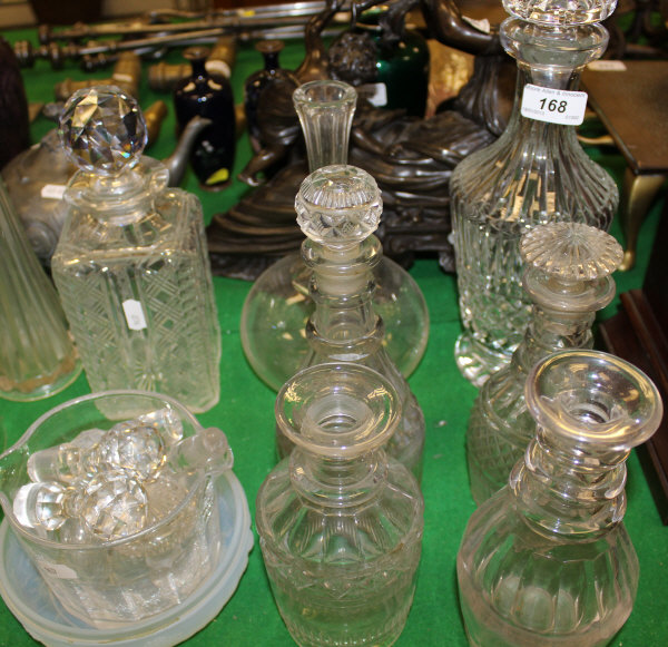 A collection of seven 19th / 20th Century cut glass decanters and stoppers, a glass mixing bowl,