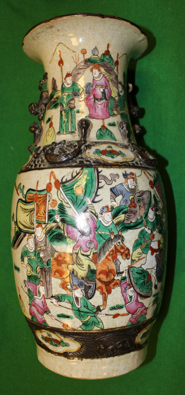 A late 19th Century Chinese export pottery vase decorated with figures and horsemen on a crackle