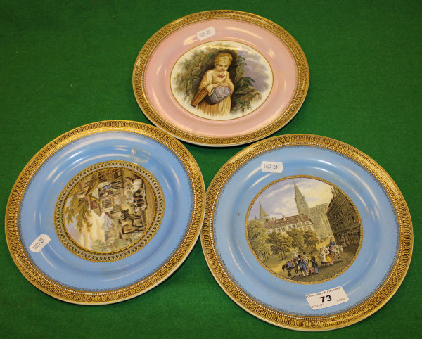 A pair of Prattware transfer decorated plates, one depicting figures outside an inn with cattle,