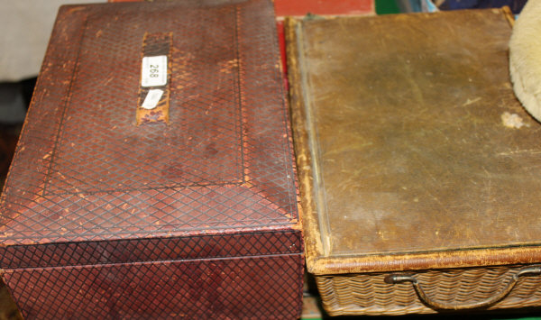 A leather covered stationery box with hinged lid enclosing a lift out tray, a stationery basket with