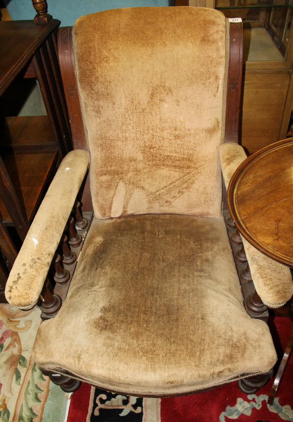 A Victorian mahogany framed salon armchair with scroll back above galleried arms and bow fronted