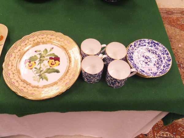 A set of four Wedgwood coffee cans and saucers decorated in blue and white with all-over floral