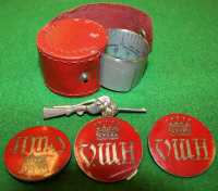 Three VW Hunt badges with red enamelled decoration, a tie clip in the form of a shotgun and hound,