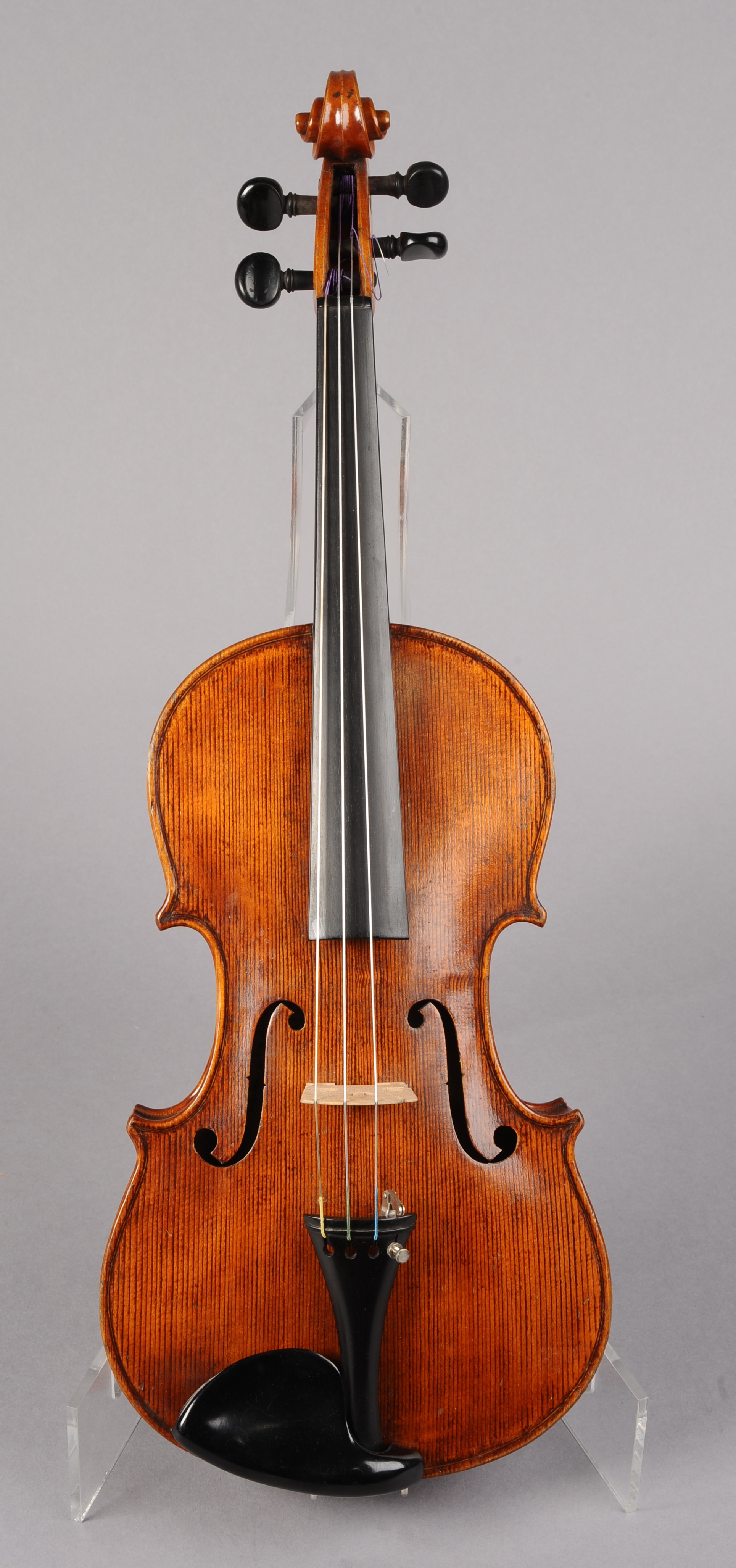 A VIOLIN, bearing label Carlo Storioni and dated 1845, with two-part back, measuring 35.5cm below