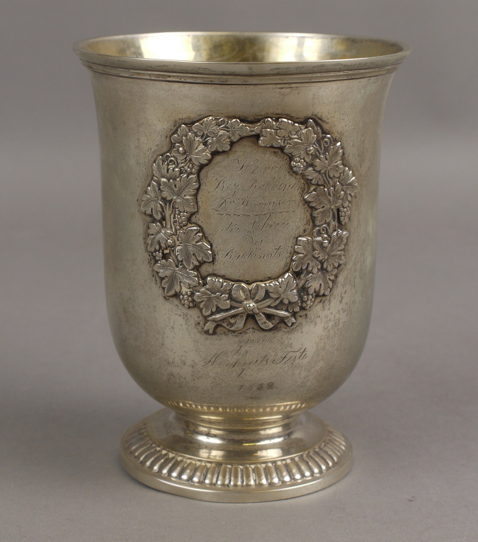 A GERMAN 13 STANDARD SILVER BEAKER, circa 1850, with moulded rim and gadroon bordered foot,