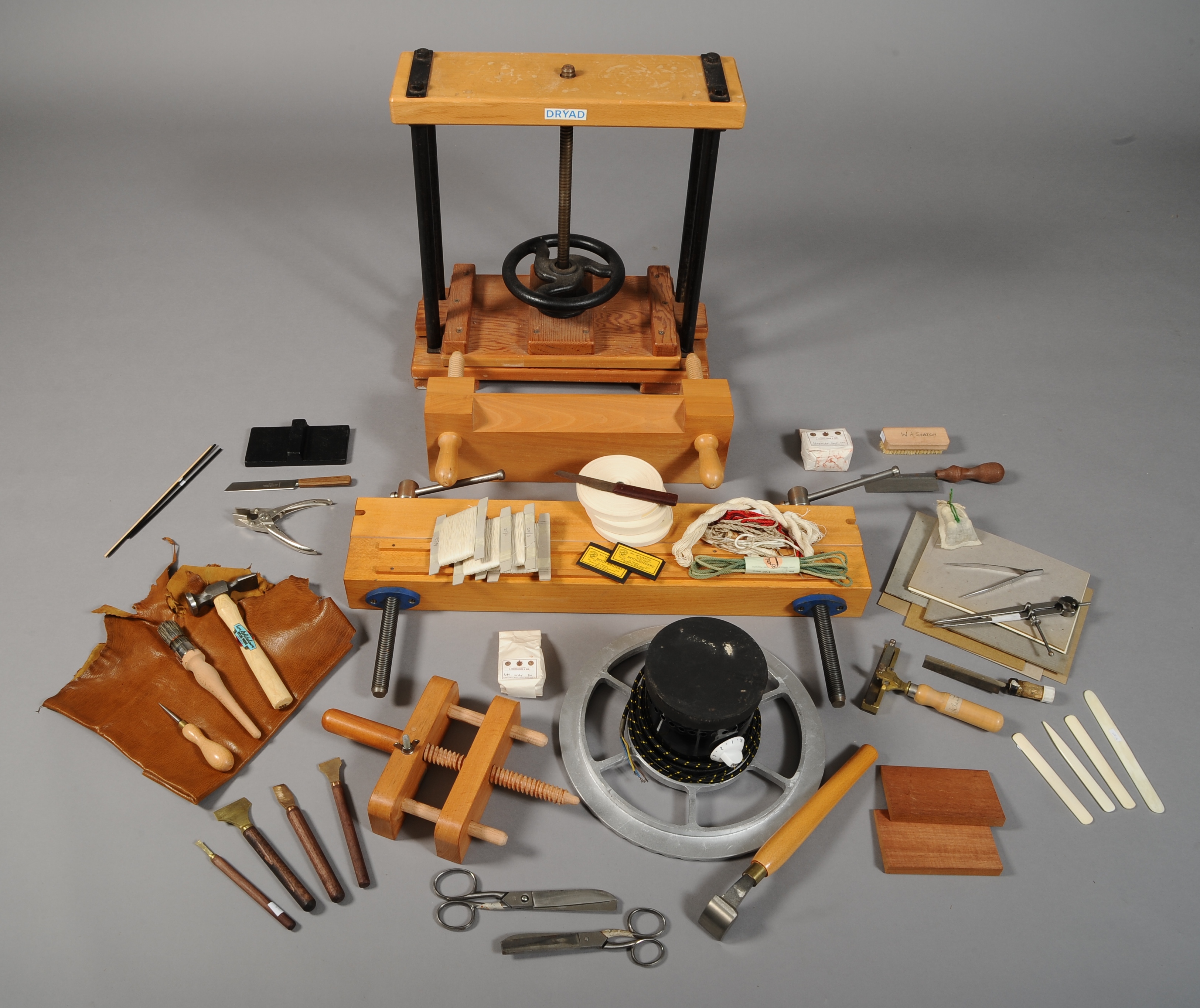 A COMPREHENSIVE COLLECTION OF BOOKBINDING EQUIPMENT, INCLUDING: Dryad book press, large laying