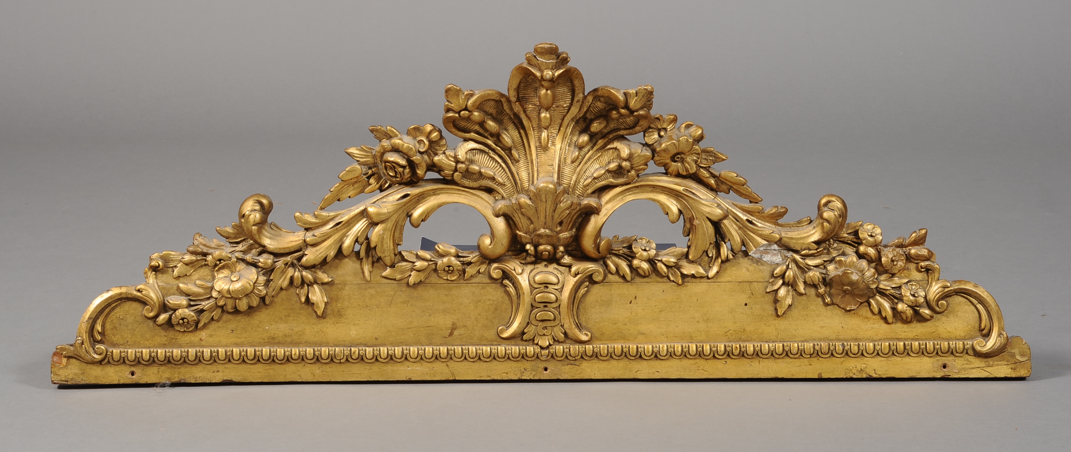 A 19TH CENTURY GILTWOOD AND GESSO PEDIMENT, of 18th century style, with fan, flower and foliate