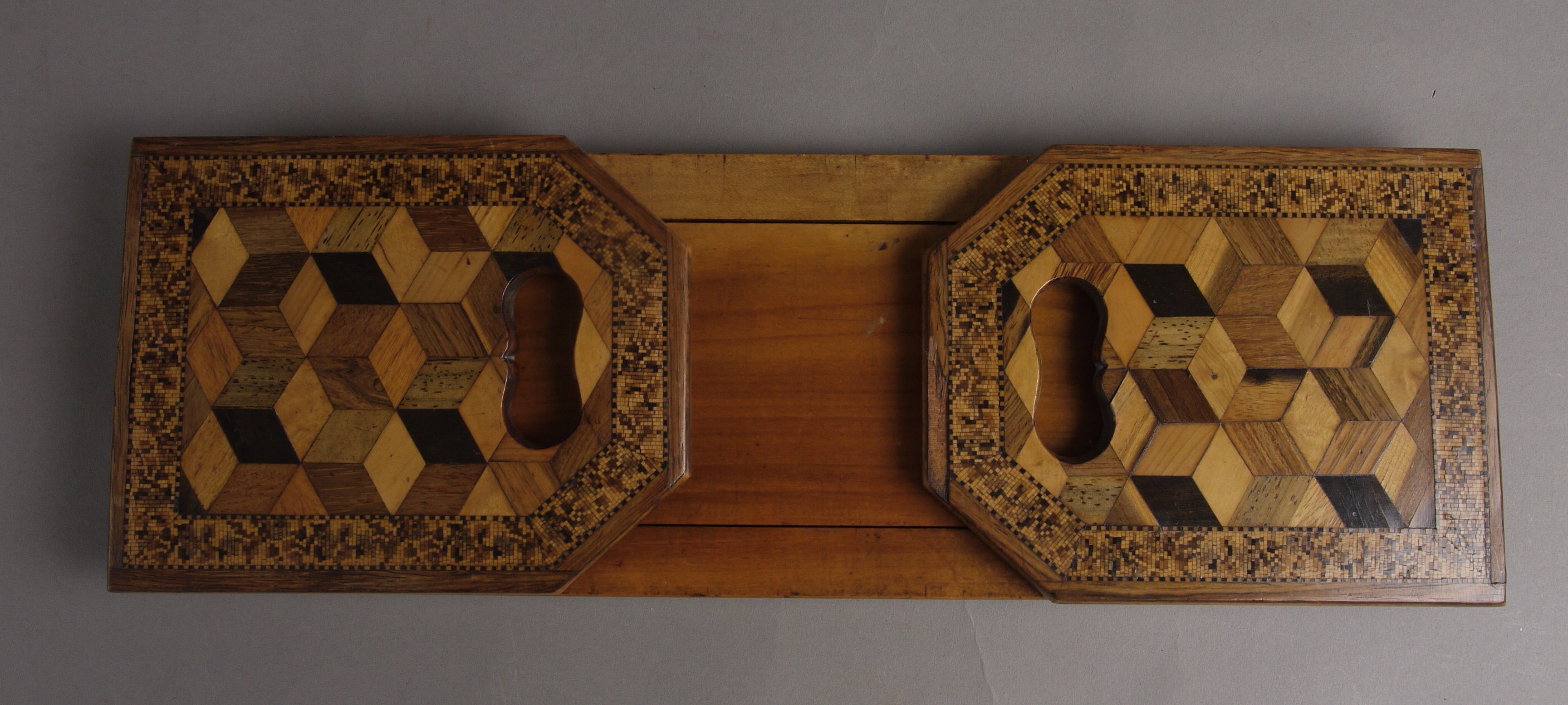 A 19TH CENTURY TUNBRIDGEWARE ADJUSTABLE BOOKSTAND, the rectangular canted end panels with finger
