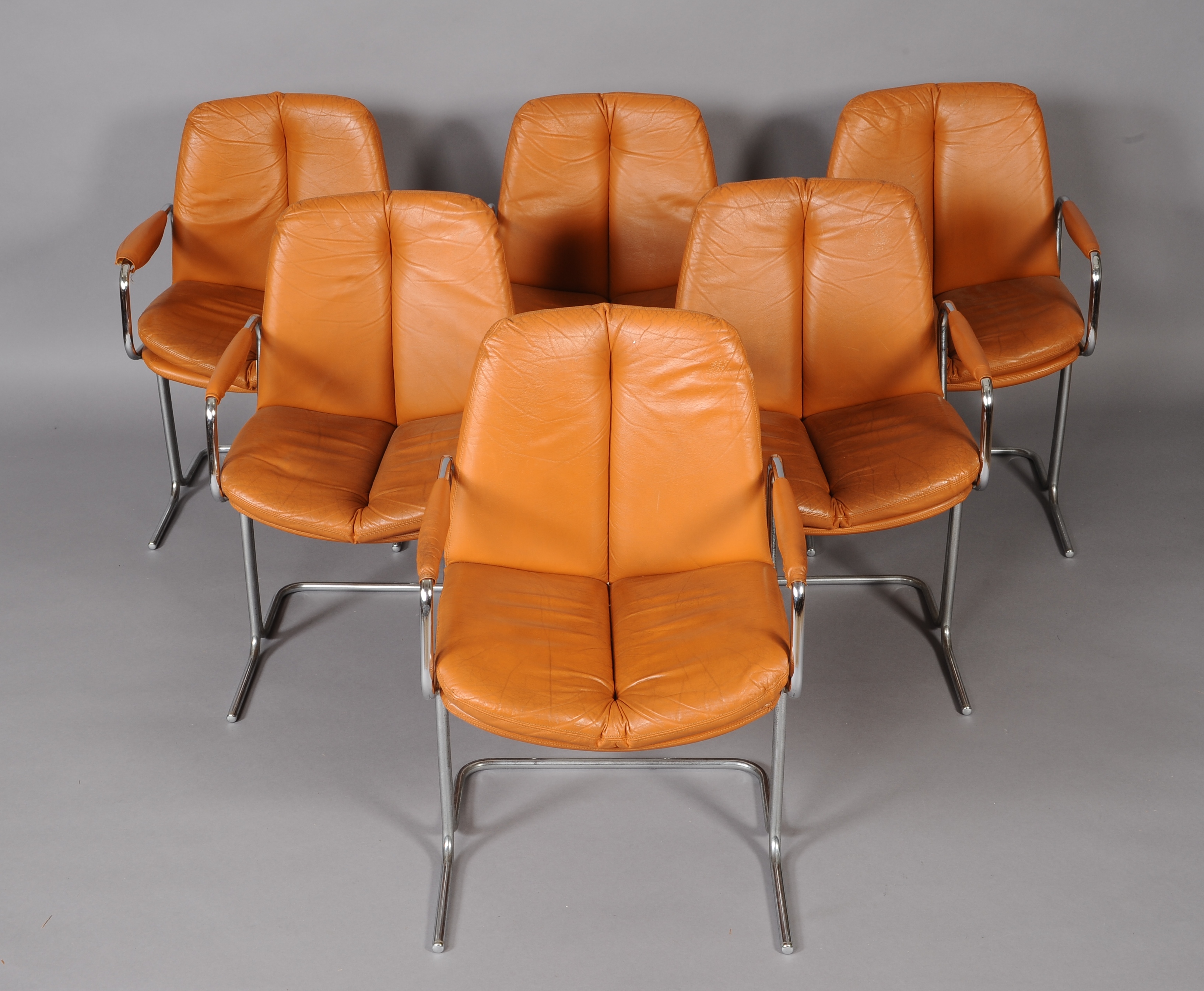 PIEFF OF WORCESTER c.1970s, set of six burnt orange leather and chrome armchairs, having