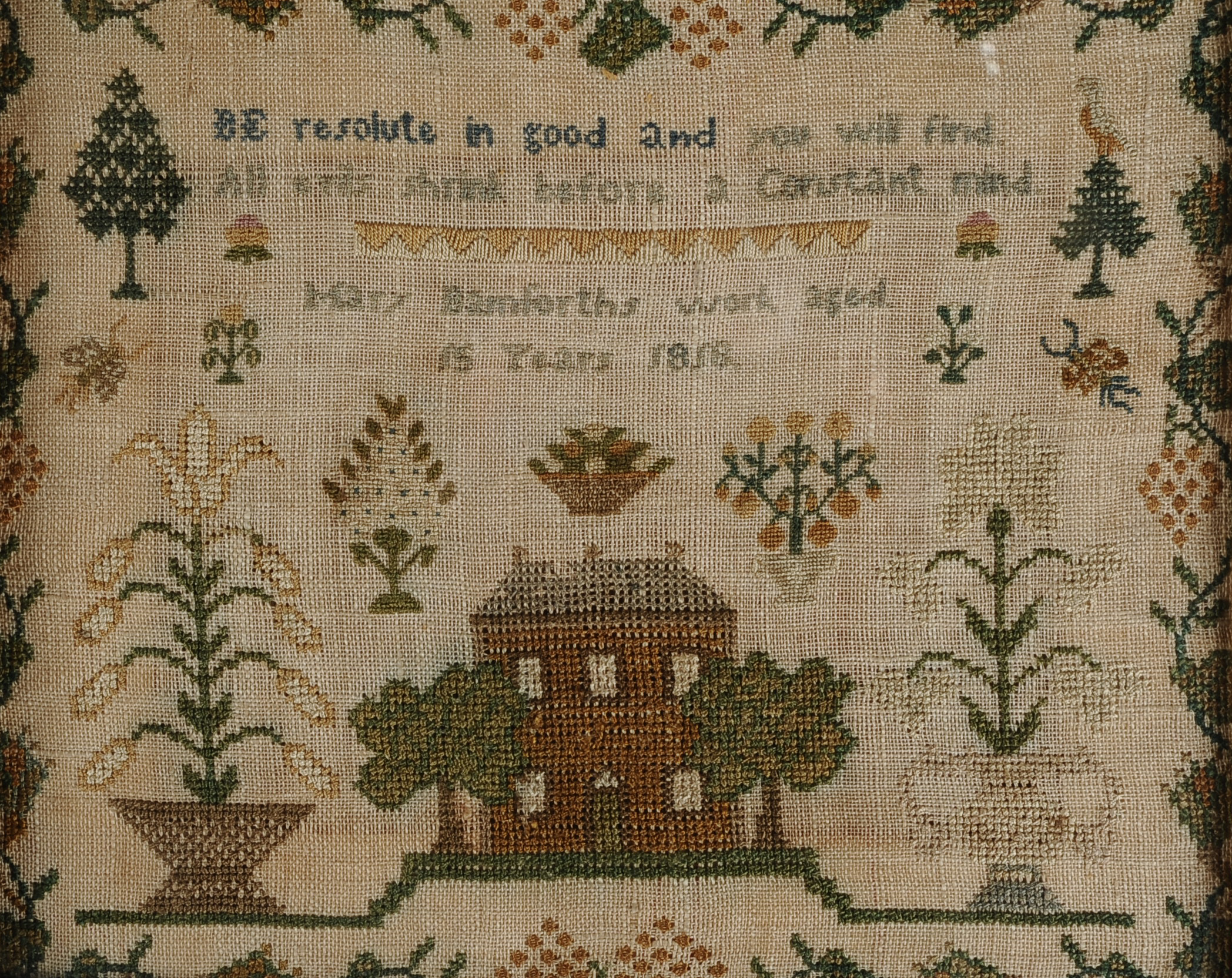 A GEORGE III PERIOD SAMPLER, by Mary Bamforth, aged 15 years and dated 1818, worked in coloured