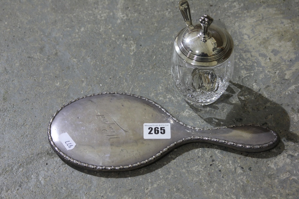 A Silver Backed Dressing Mirror Together With A Silver Topped Glass Preserve Jar