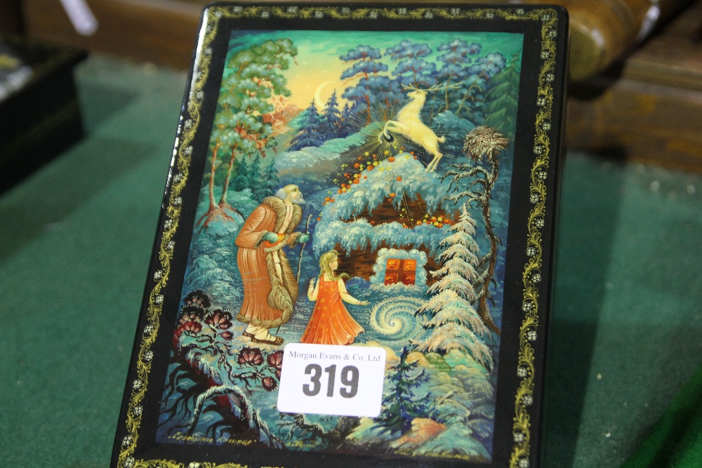 A Russian Lacquer Work Trinket Box With Painted Scene To The Lid Titled "The Golden Stag" Signed