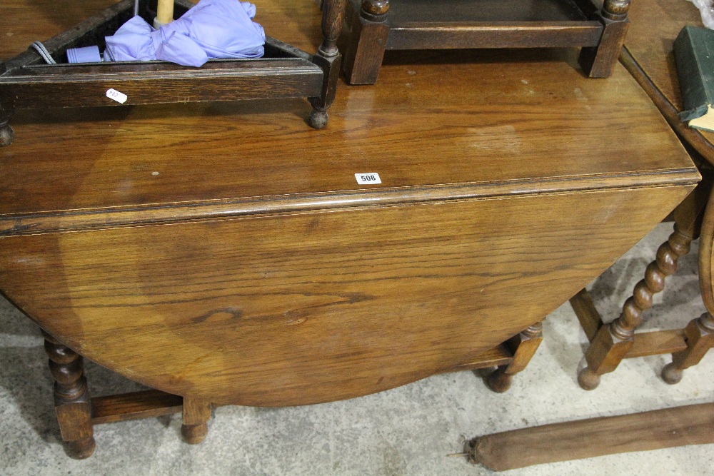 A Polished Oak Gate Leg Table Together With A Polished Fire Screen