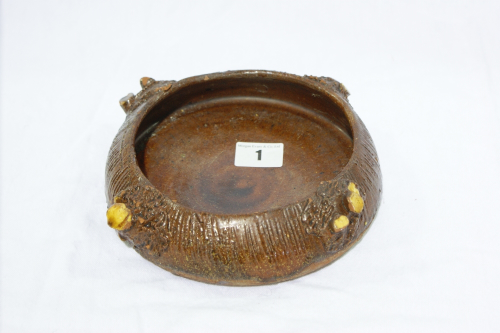 A Circular Buckley Pottery Slip Ware Glazed Water Bowl Of Circular Form 7" Diameter