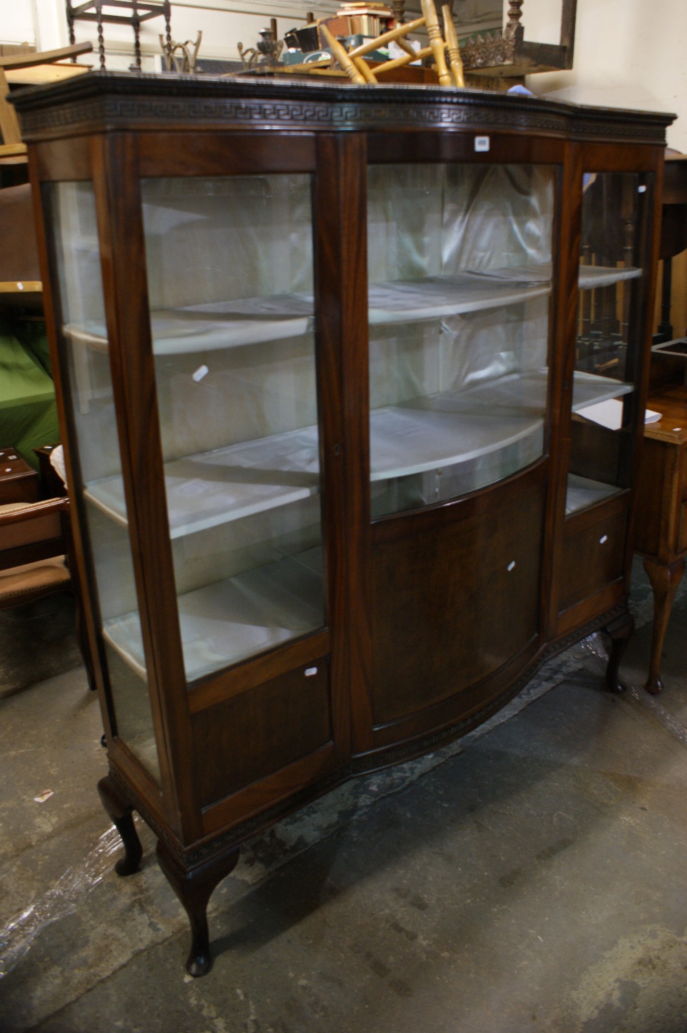 An Edwardian Mahogany Display Cabinet With Bowed Centre