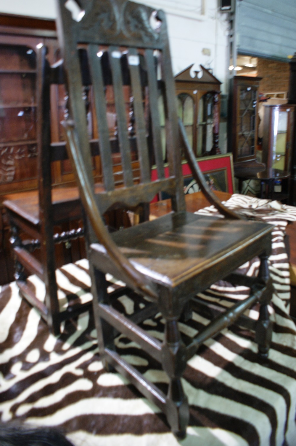 An 18th Century Oak Splat Back Chair With Carved Top Rail And Block And Turned Supports