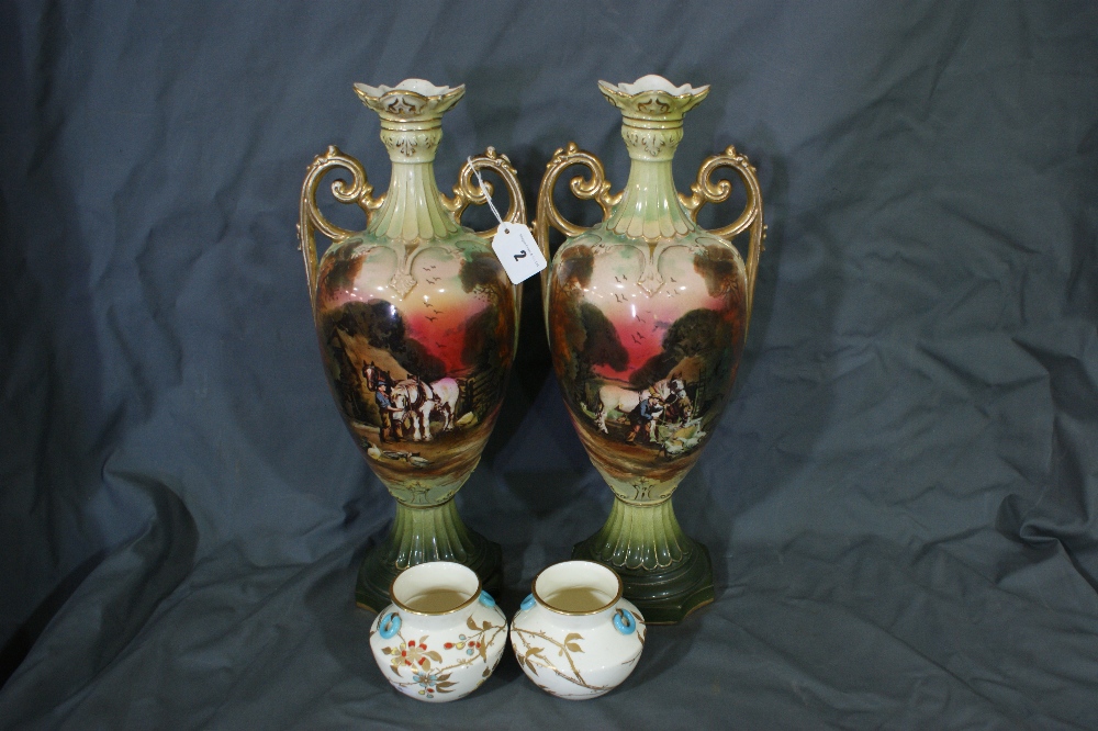 A Pair Of Edwardian Pottery Transfer Decorated Two Handled Vases Together With A Pair Of Gilt Floral