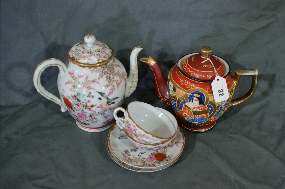 An Early 20th Century Oriental Figural Tea Pot Together With A Similar Bird And Floral Decorated Tea