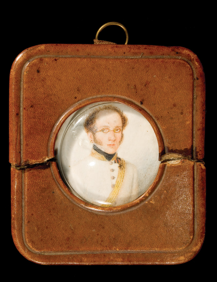 *Russia, Portrait Miniature: A 19th Century glazed leather-framed portrait miniature of a Guards