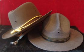 Two American Police Force Hats: Cowboy style Stetson hats 1 in Brown swade and the other in hard