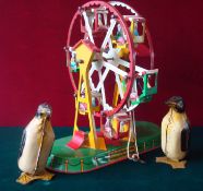 Tin Plate Clockwork Ferris Wheel & Penguins: Having German made JW Ferris Wheel together with 2