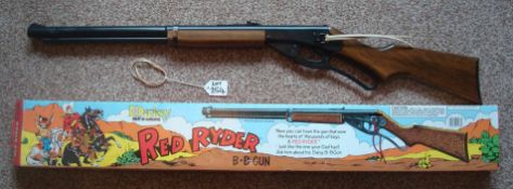 Daisy Red Rider BB Gun: Winchester style Rifle having wooden stock with original illustrated box