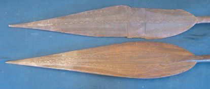 2 early 20th Century carved Tribal Oceania paddle clubs: Both having stylised carved designs to