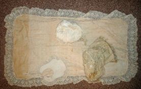 Small Selection of Baby Items: To include Bonnet, Hat (having damage) Cot Over Blanket together with