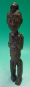 Early 20th Century African wooden carved figure of a man: having carved designs and detailing.